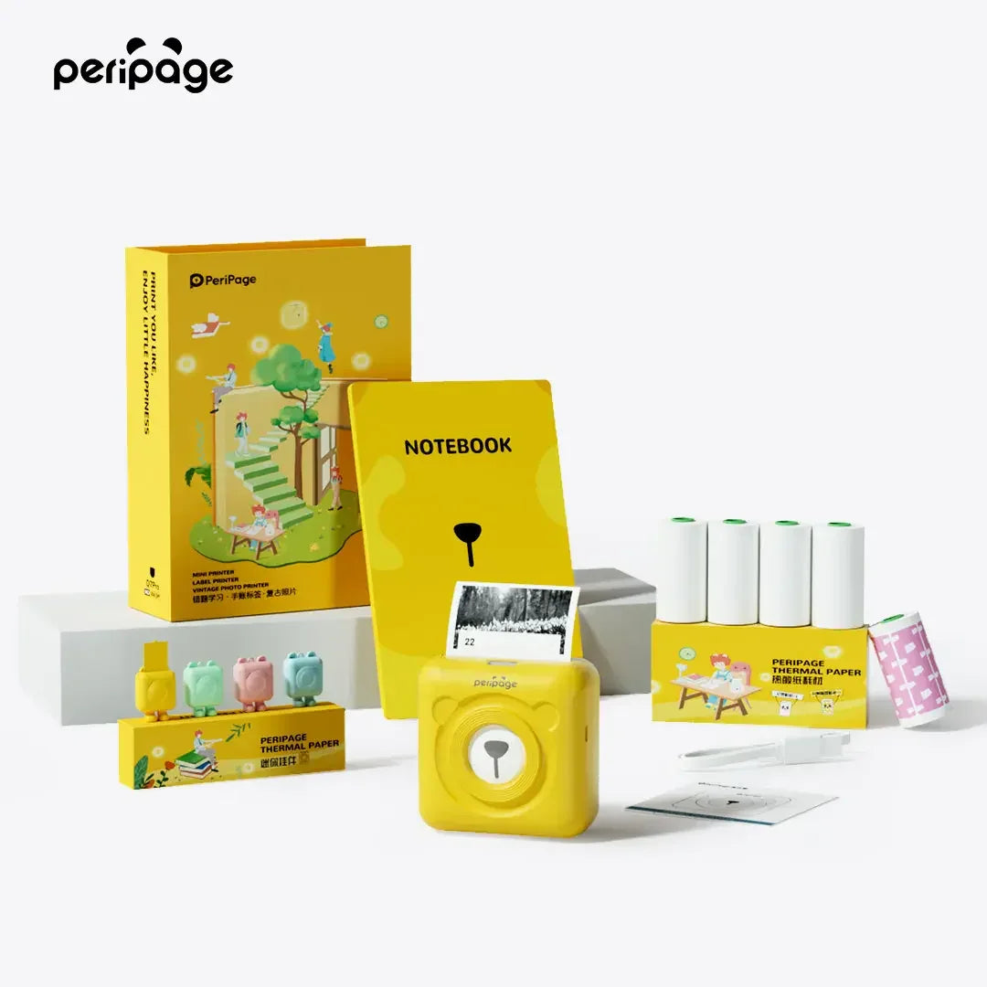 PeriPage 2" A6 Mini Printer gift box with yellow compact printer, thermal paper rolls, notebook, stickers, and accessories.